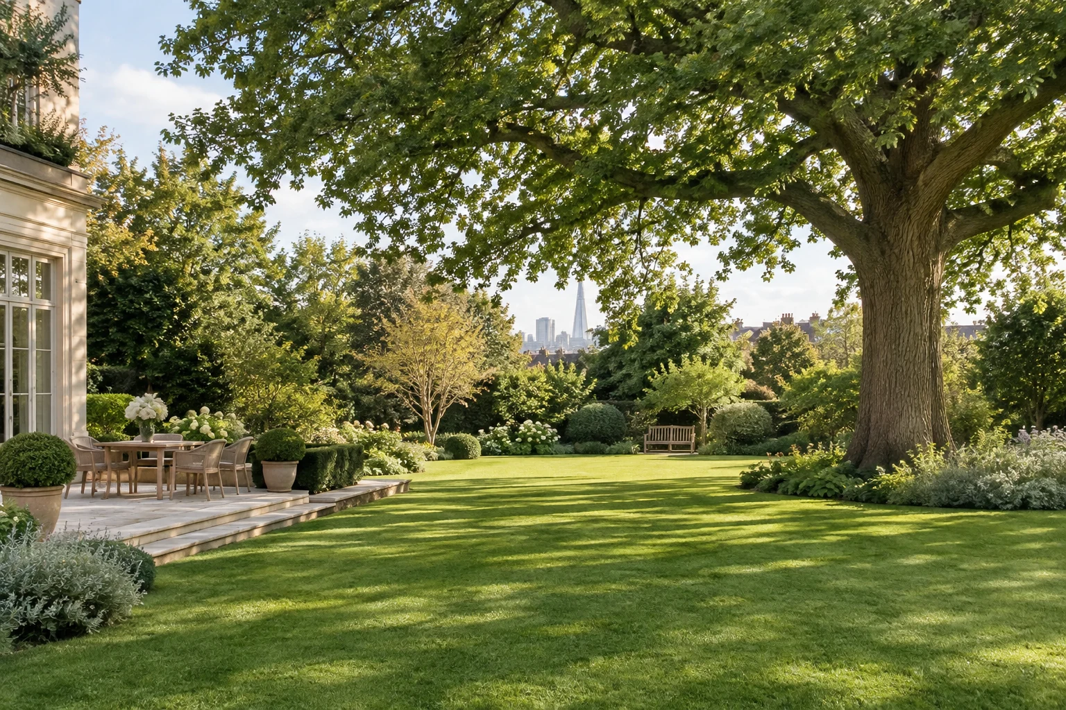 Mature oak canopy above a landscaped garden lawn